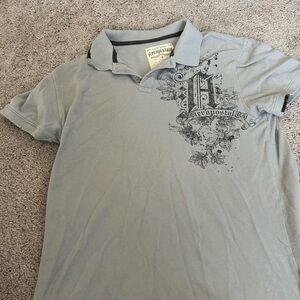 Two men’s short sleeve shirts, size, large and extra large